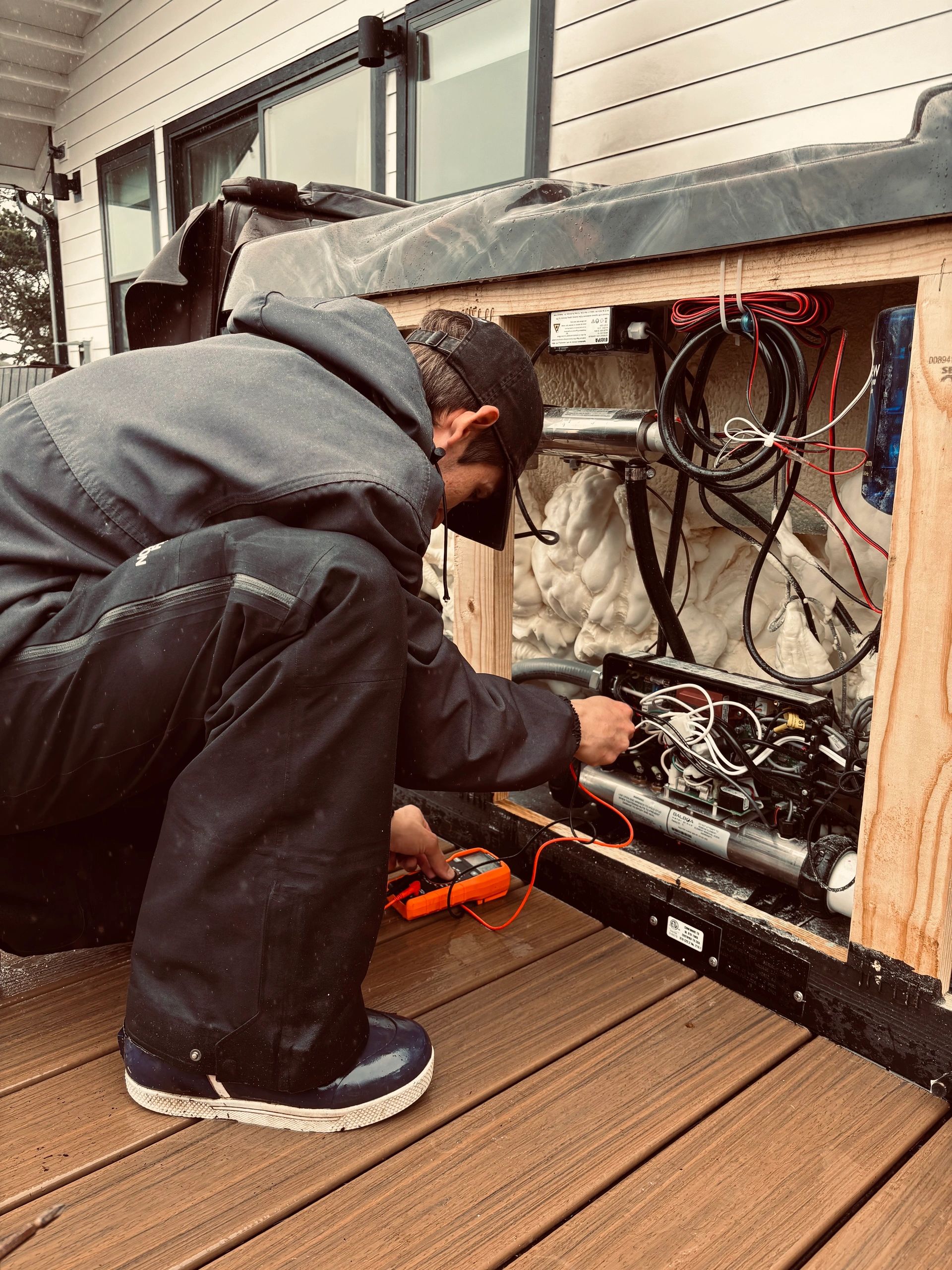 Clear Water Spa Service technician servicing a hot tub